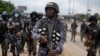 FILE - Police patrol during a protest against the economic hardship on the street in Lagos, Nigeria, Aug. 2, 2024. Nigeria Protests