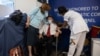 Yehuda Widawsky, a 102-year-old Holocaust survivor, receives a third Pfizer-BioNTech COVID-19 vaccine at a hospital in Tel Aviv, Israel, Aug. 1, 2021.