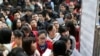 FILE - Candidates arrive for China's national civil service exam at a university in Nanjing, Jiangsu province, Nov. 24, 2013. Competition for civil service positions has intensified in 2024.