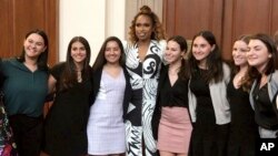 This image taken from video shows singer Jennifer Hudson posing with student journalists from Marjory Stoneman Douglas High School in Parkland, Fla., who were recognized at the 2019 Pulitzer Prize winners awards luncheon at Columbia University in New York, May 28, 2019.