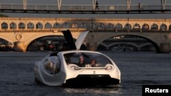 The Bubbles water taxi is seen on the River Seine during a demonstration by the SeaBubbles company in Paris, France, September 16, 2019. 