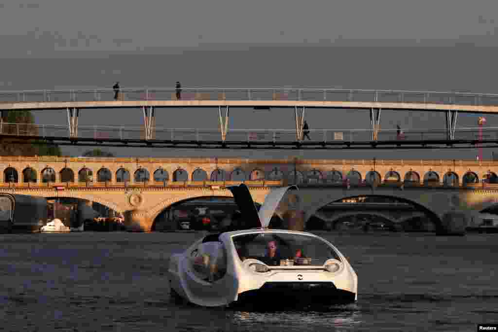 The Bubbles water taxi is seen on the River Seine during a demonstration by the SeaBubbles company in Paris, France.