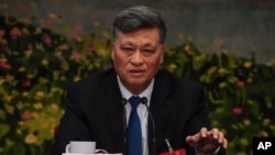 FILE - Ma Xingrui, Communist Party secretary of China's Xinjiang Uyghur Autonomous Region, speaks as he leads a meeting on the sidelines of the National People's Congress at the Great Hall of the People in Beijing, March 7, 2024.