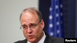FILE - Assistant Secretary for Terrorist Financing in the U.S. Department of the Treasury Marshall Billingslea, currently president of the Financial Action Task Force (FATF), speaks during a news conference in Riga, Latvia, May 16, 2019.
