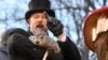 Groundhog Club handler A.J. Dereume holds Punxsutawney Phil, the weather prognosticating groundhog, during the 139th celebration of Groundhog Day on Gobbler's Knob in Punxsutawney, Pa., Feb. 2, 2025. 