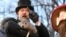 Groundhog Club handler A.J. Dereume holds Punxsutawney Phil, the weather prognosticating groundhog, during the 139th celebration of Groundhog Day on Gobbler's Knob in Punxsutawney, Pa., Feb. 2, 2025. 