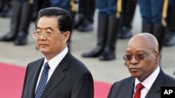 South African President Jacob Zuma, right, walks with Chinese President Hu Jintao during a welcome ceremony held outside the Great Hall of the People in Beijing, (File).