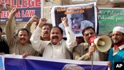 Pakistani protesters rally to condemn the arrest in London of WikiLeaks founder Julian Assange, seen in poster, during a protest in Multan, Pakistan, on Dec. 9, 2010.