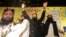 Sheikh Yaqub (C) candidate of the newly-formed Milli Muslim League party, waves to his supporters at an election rally in Lahore, Pakistan, Sept. 14, 2017.