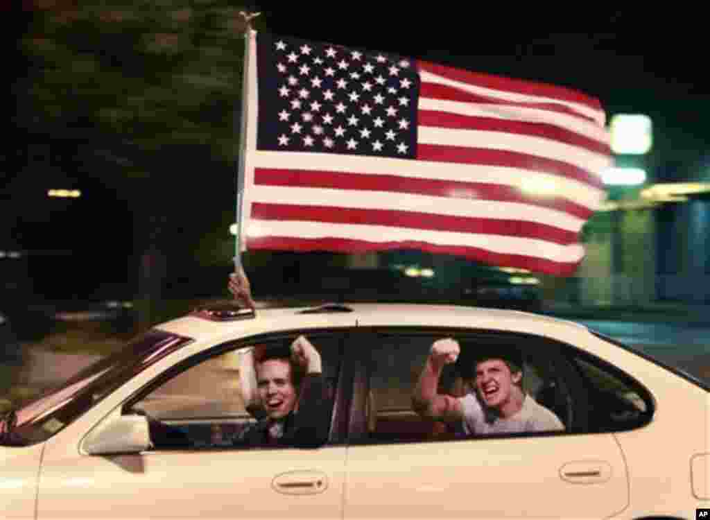 A driver and passengers celebrate the death of Osama bin Laden in the streets of Lawrence, Kansas, Sunday, May 1, 2011 (AP Photo/Orlin Wagner)