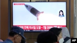 A TV screen shows a file image of a North Korean missile launch during a news program at Seoul Railway Station in Seoul, South Korea, Sept. 12, 2024. Seoul said Pyongyang fired a ballistic missile toward the North's eastern waters Thursday. 