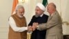 A photo released by the official website of the office of the Iranian Presidency, shows Afghan President Ashraf Ghani (R), Iranian President Hassan Rouhani (C), and Indian Prime Minister Narendra Modi, holding hands in a show of solidarity after their trilateral meeting and signing agreements in Tehran, May 23, 2016.
