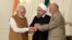 A photo released by the official website of the office of the Iranian Presidency, shows Afghan President Ashraf Ghani (R), Iranian President Hassan Rouhani (C), and Indian Prime Minister Narendra Modi, holding hands in a show of solidarity after their trilateral meeting and signing agreements in Tehran, May 23, 2016.