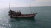 This undated photo released by Malaysian Maritime Enforcement Agency on Jan. 4, 2025, shows a boat with Rohingya refugees attempting to enter the country on the northeastern resort island of Langkawi, Malaysia. (MMEA via AP)