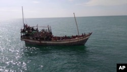 This undated photo released by Malaysian Maritime Enforcement Agency on Jan. 4, 2025, shows a boat with Rohingya refugees attempting to enter the country on the northeastern resort island of Langkawi, Malaysia. (MMEA via AP)