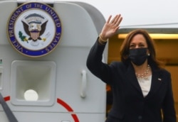 U.S. Vice President Kamala Harris waves as she boards Air Force Two at Benito Juarez International airport following her first international trip as Vice President to Guatemala and Mexico, in Mexico, June 8, 2021.