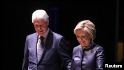 FILE - Former Secretary of State Hillary Clinton and former President Bill Clinton appear together at an event at Beacon Theatre in New York, April 11, 2019.