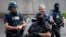 French police and anti-crime brigade (BAC) members secure a street as they carried out a counter-terrorism swoop at different locations in Argenteuil, a suburb north of Paris, France, July 21, 2016. 