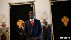 FILE - Guinea-Bissau's President Jose Mario Vaz speaks with journalists.