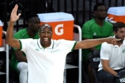 Nigeria coach Mike Brown calls to the team during an exhibition basketball game against the United States on Saturday, July 10, 2021, in Las Vegas.