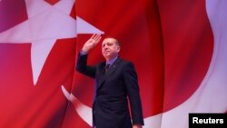 Turkish President Tayyip Erdogan greets supporters during an event ahead of the constitutional referendum in Istanbul, Turkey April 12, 2017. 