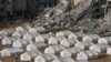 A tent camp for displaced Palestinians is set up next to destroyed buildings following the Israeli air and ground offensive in Jabaliya, Gaza Strip, Feb. 6, 2025. 