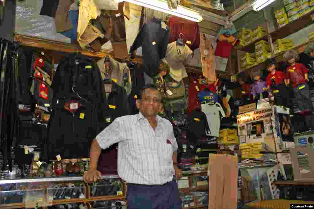 Hundreds of pants and jackets fill the cramped and dingy tailor shop with a fresh smell of new fabric in a shop he once shared with his brothers. Chhiba still works a 12-hour day. Photo by Darren Taylor