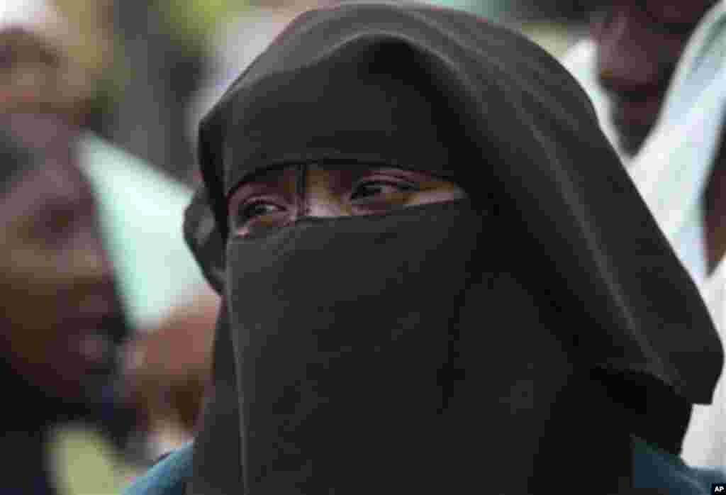 A Muslim woman waits in line to vote during a gubernatorial election in Kaduna, Nigeria, Thursday, April 28, 2011. Two states in Nigeria's Muslim north voted Thursday for state gubernatorial candidates after their polls were delayed by violence that kille