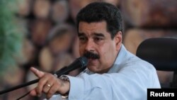 Venezuela's President Nicolas Maduro speaks during a visit to an industrial sawmill in Chaguaramas, Venezuela, Aug. 18, 2016. (Miraflores Palace/Handout)