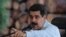 FILE - Venezuela's President Nicolas Maduro speaks during a visit to an industrial sawmill in Chaguaramas, Venezuela, Aug. 18, 2016. (Miraflores Palace/Handout)