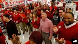Target CEO Brian Cornell joins store team members before the Thanksgiving opening, Nov. 24, 2016, in Jersey City, N.J.