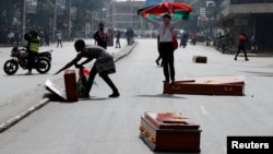 Caskets, dropped by protesters, lie on the road during a demonstration over police killings of people protesting tax increases, in Nairobi, Kenya, July 2, 2024.