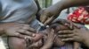 An ethnic Kachin child suffering from malaria receives a traditional treatment at a camp for people displaced by fighting between government troops and the Kachin Independence Army, outside the city of Myitkyina in northern Burma, February 22, 2012.