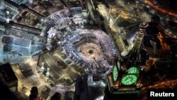 An aerial view shows Muslim worshippers praying at the Grand mosque, the holiest place in Islam, in the holy city of Mecca during Ramadan July 14, 2015, on Lailat al-Qadr, or Night of Power, on which the Koran was revealed to Prophet Mohammad by Allah. 