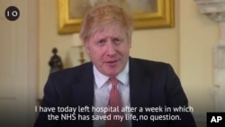 A grab done from the Twitter page of Britain's Prime Minister Boris Johnson, in which he hails the staff in the National Health Service (NHS) for saving his life, filmed at 10 Downing Street, London, Sunday April 12, 2020.