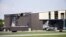 Esta imagen muestra un hangar dañado tras recibir el impacto de un avión bimotor que despegaba en el aeropuerto de Addison, Texas, el domingo, 30 de junio, de 2019. No hubo sobrevivientes.