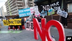 Anti-war activists stage a rally against the South Korean government's decision to send troops to Hormuz Strait, near the U.S. Embassy in Seoul, South Korea, Jan. 21, 2020.