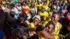 Supporters of ZANU PF cheer for their candidates for parliament after a ZANU PF election campaign rally addressed by Vice President Constantino Chiwenga at a school near Harare, on July 27, 2018.