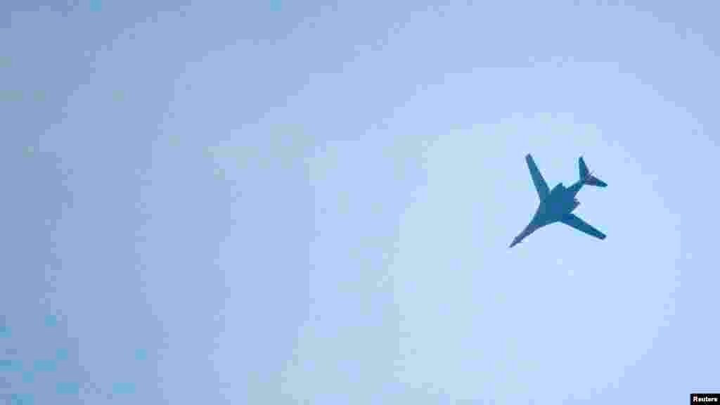 A U.S.-led coalition aircraft flying over Kobanii, as seen near the Mursitpinar border crossing on the Turkish-Syrian border in the southeastern town of Suruc, Sanliurfa province, Oct. 18, 2014. 