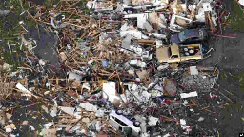 This aerial photo shows the remains of houses in Moore, Okla., following a tornado Monday, May 20, 2013.