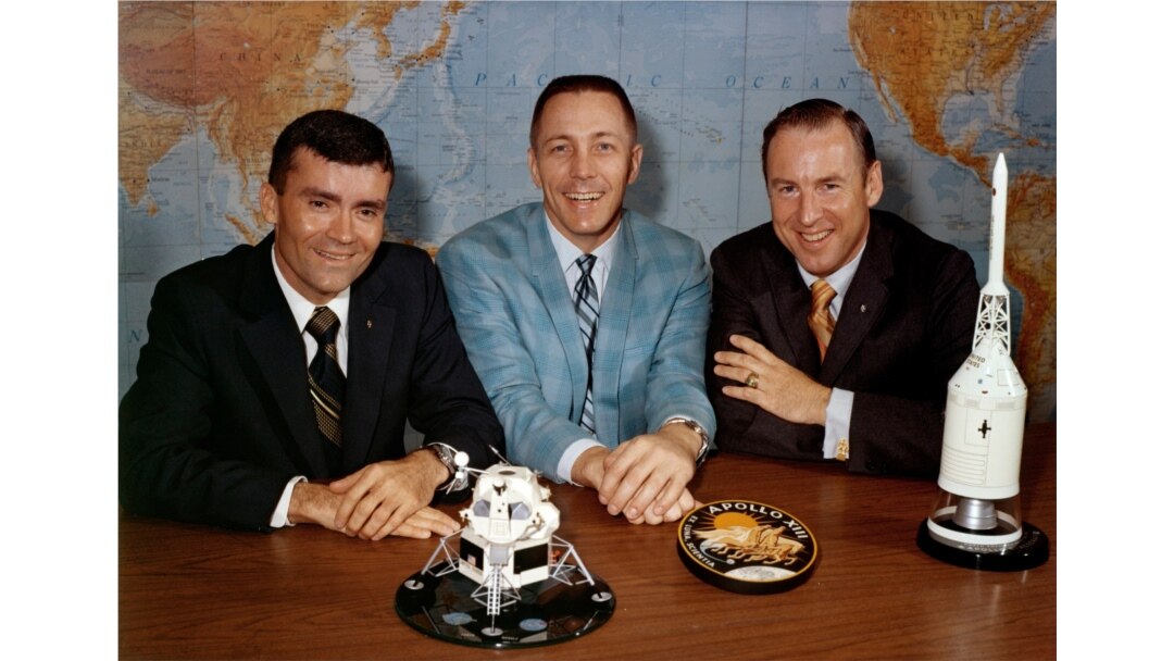 FILE - In this April 10, 1970, photo made available by NASA, Apollo 13 astronauts, from left, Fred Haise, Jack Swigert and Jim Lovell pose for a photo on the day before launch.