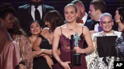 Taylor Schilling and the cast of "Orange Is the New Black" accept the award for outstanding performance by an ensemble in a comedy series at the 23rd annual Screen Actors Guild Awards, Jan. 29, 2017, in Los Angeles. A hacker claims to have stolen the upcoming season of the series.