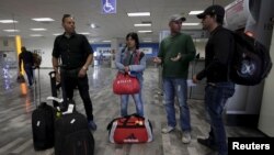 Cuban migrants arrive after traveling en route from Costa Rica to El Salvador, Guatemala and Mexico, before heading to the U.S., at General Lucio Blanco International airport in Reynosa, in Tamaulipas state, Mexico, Jan. 17, 2016. 