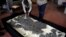 FILE - A fossil of an ichthyosaur is seen at the Jurassic Museum of Asturia in Colunga, northern Spain, Nov. 6, 2015. 