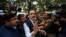FILE - head of Sahara India conglomerate Subrata Roy speaks to the media as he arrives at the Supreme Court for a hearing in New Delhi, India, Mar. 4, 2014.