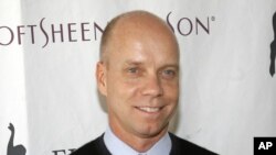 FILE - Former Olympic figure skating gold medalist Scott Hamilton.