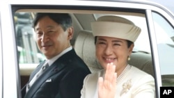 Japan's new Emperor Naruhito and new Empress Masako are driven to Imperial Palace May 1, 2019. (AP Photo/Koji Sasahara)