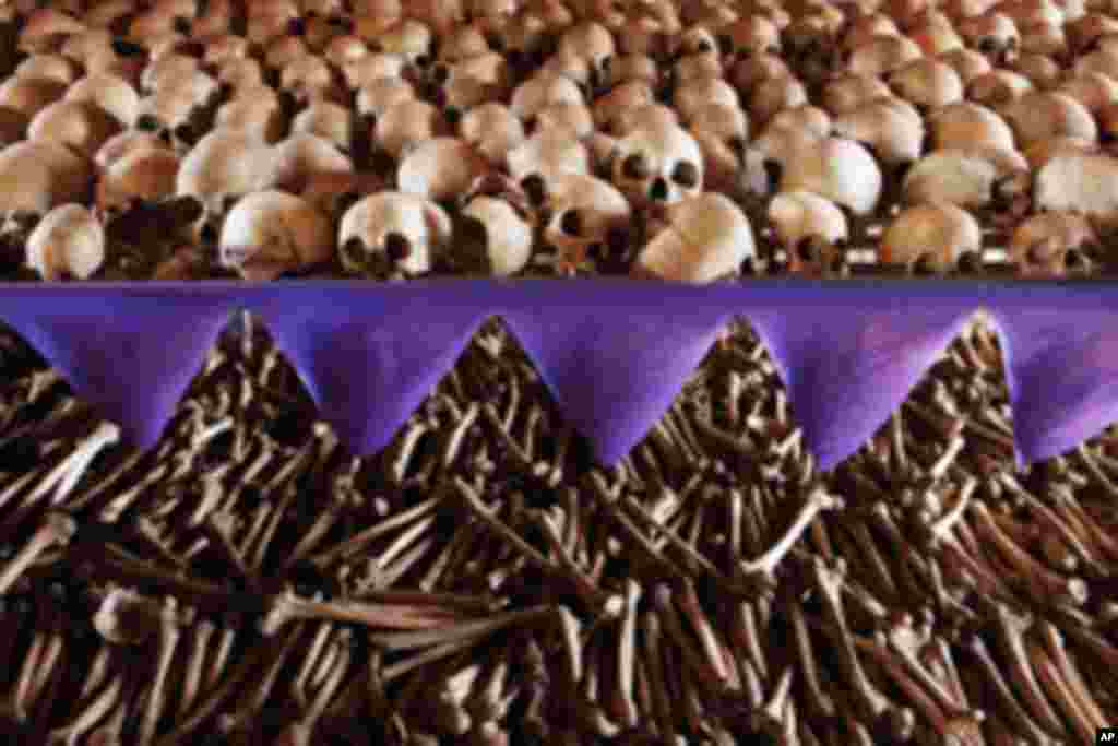 The skulls and bones of Rwandan victims rest on shelves at a genocide memorial inside the church at Ntarama just outside the capital Kigali, August 6, 2010. Some 5,000 people, mostly women and children, sought refuge near the church in April 1994, but wer
