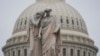 The U.S. Capitol Dome is seen behind the Peace Monument statue in Washington, Monday, Dec. 31, 2018, as a partial government shutdown stretches into its second week.