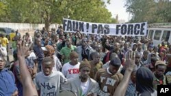 Members of a Senegalese anti-government youth movement Y En A Marre [We're Fed Up] chant slogans during a rally against President Abdoulaye Wade, in the capital Dakar, January 27, 2012.
